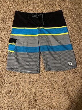 Striped Blue & Gray Board Shorts with Yellow Accents
